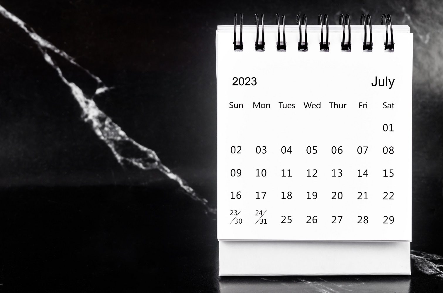 A calendar sitting on top of a table.